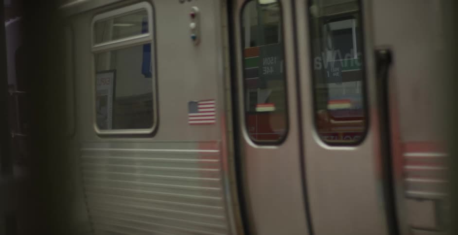 A train moves past a station in a city