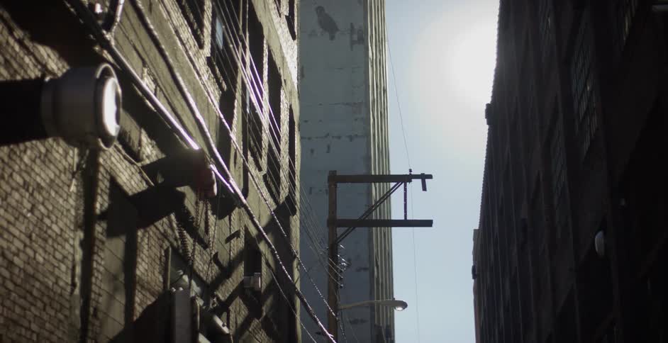 An urban alley cityscape the sun shining brightly