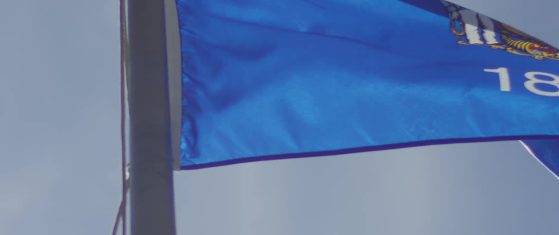 A wisconsin state flag blows in the wind