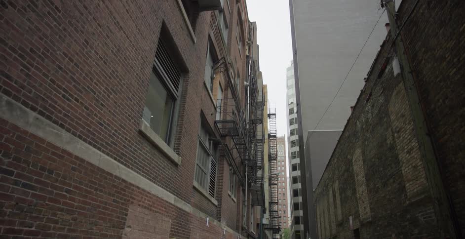 Long alley of an urban city with residential buildings around