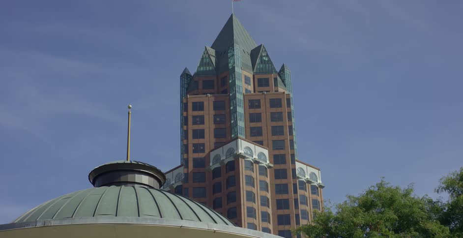 A beige and blue building with towershaped architecture