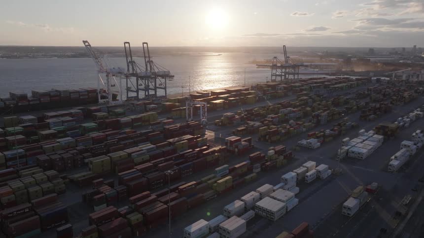 Aerial panorama of a port with containers at the seaside on a morning