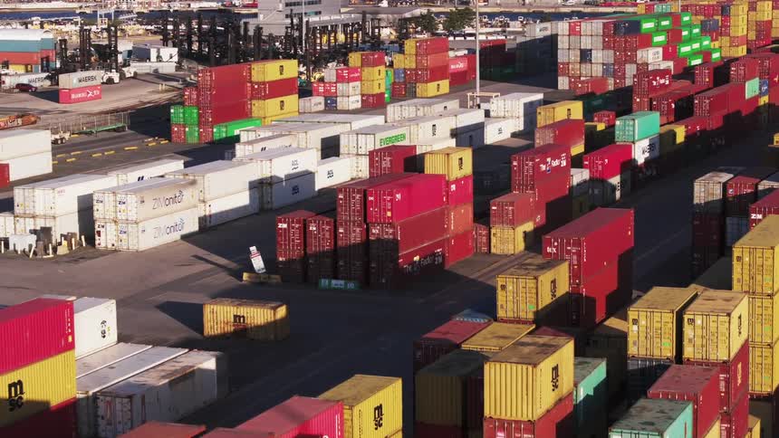 Aerial panorama of a seaside port with stacks of containers