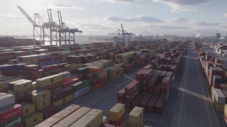 Aerial panorama of a port with stacks of containers on the waterfront
