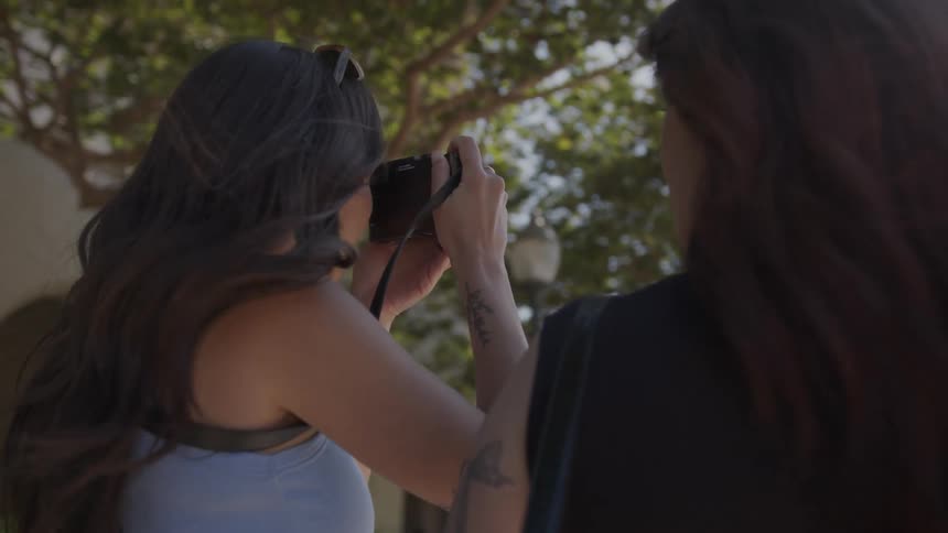 A clip of two female photographers