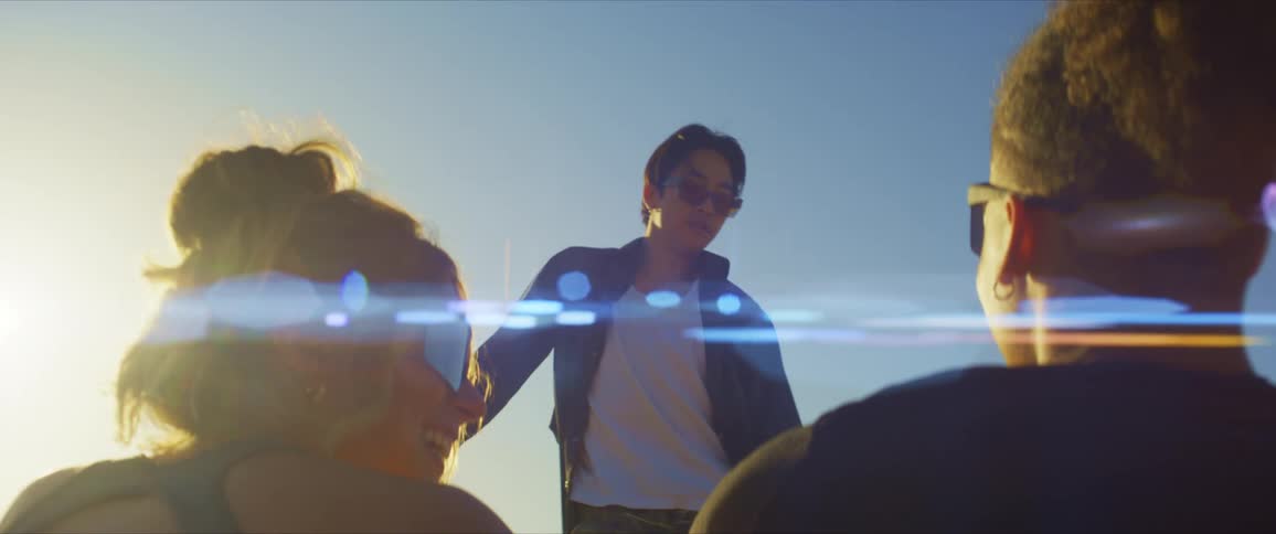 Man standing in an openair place dancing for the two people watching him