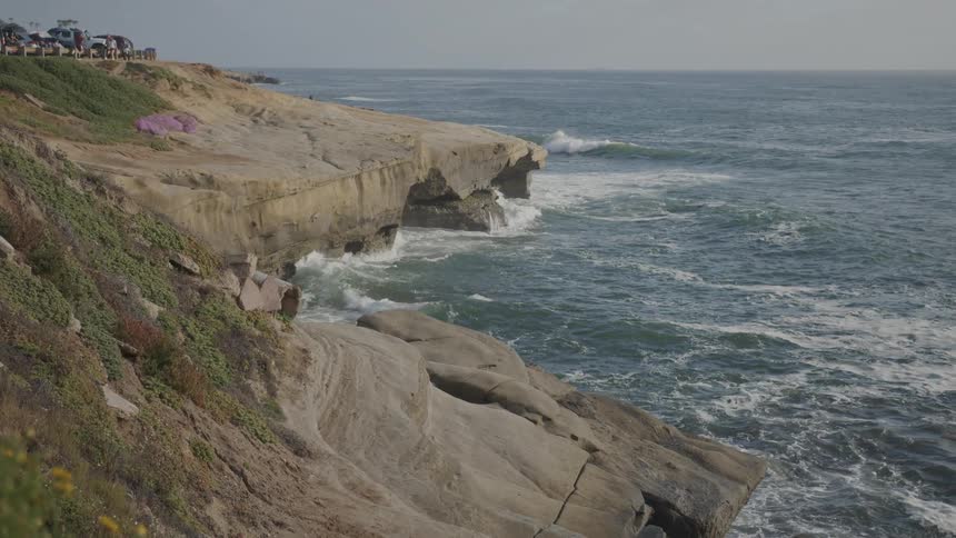 Waves crash against the shore