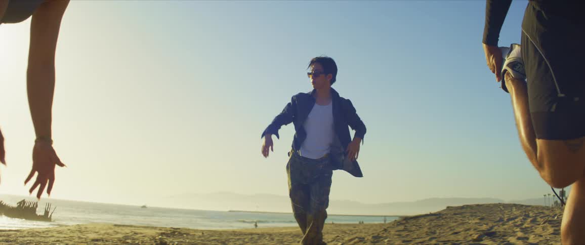 He dances as the women stretch