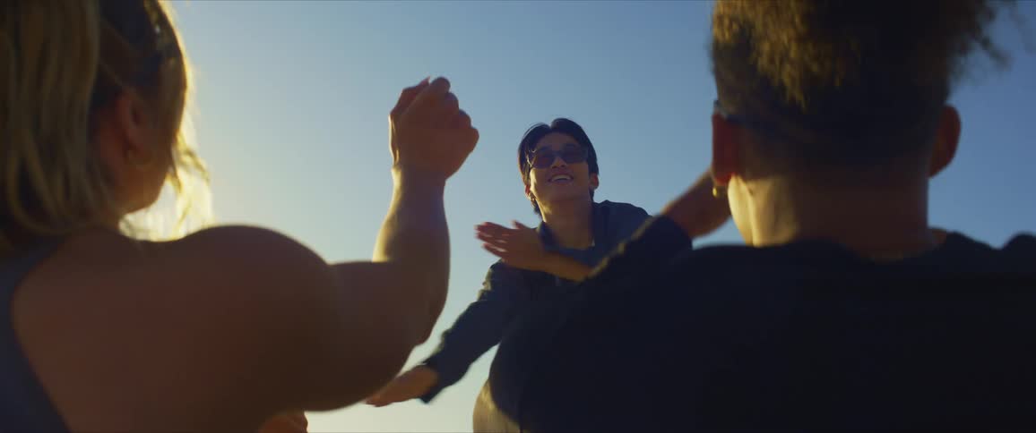 Friends cheer him on as he dances