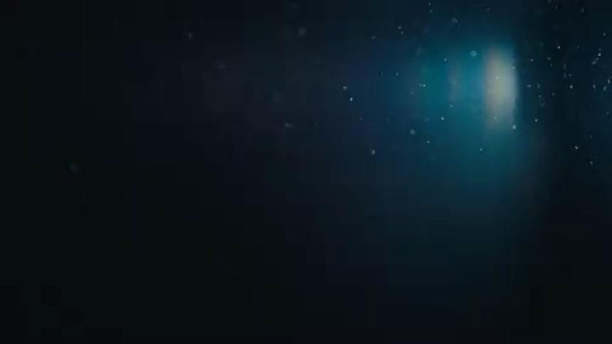 A light shines in the water