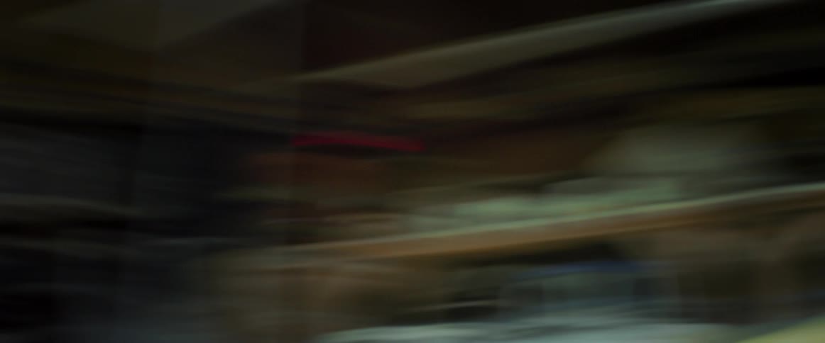 Abstract figures of a woman sitting indoors