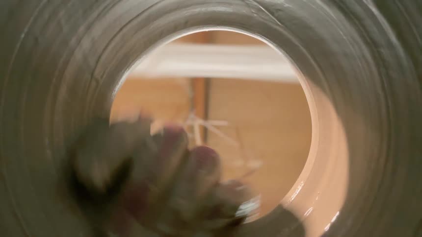 A person is sculpting with clay