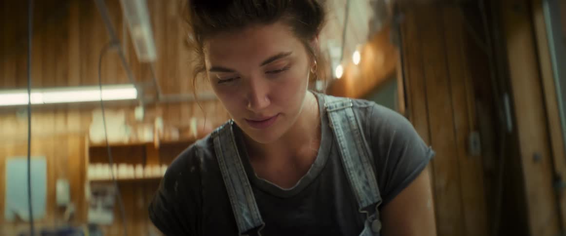 A young woman in a room staring