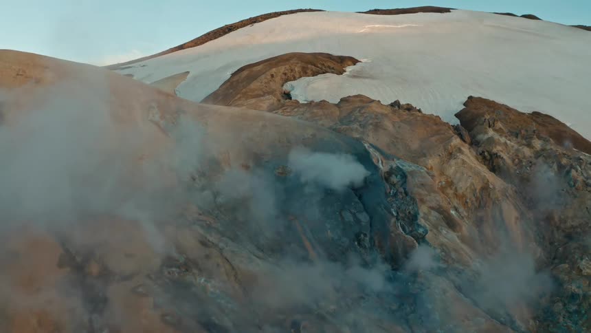 Aerial scenery of mountains with erosions coming out of smoke