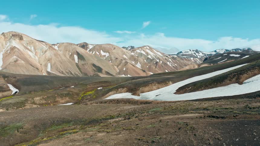 A landscape of rugged terrain and mountain ranges
