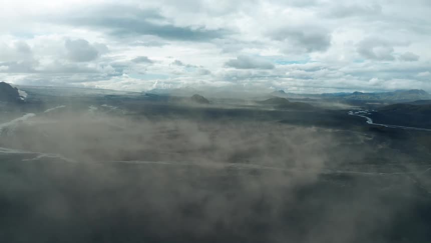 Aerial landscape of a day with fog in an arid terrain in river canals