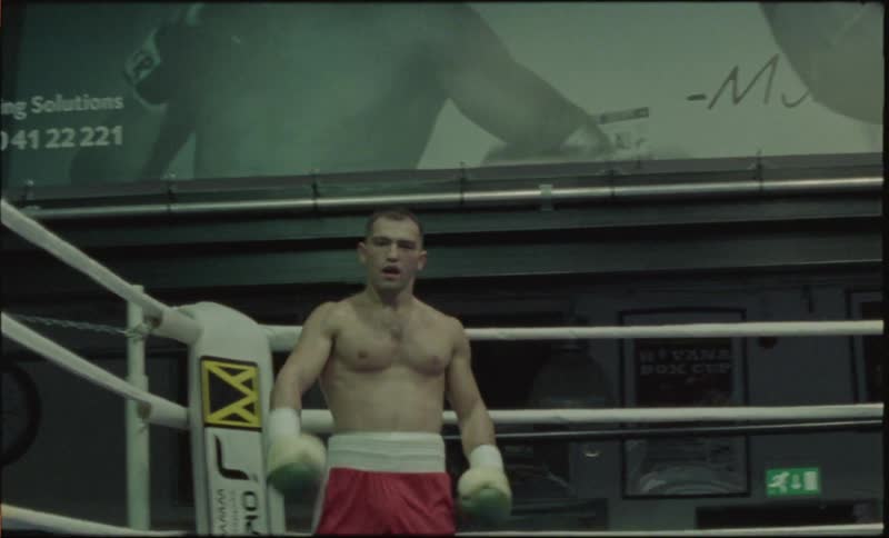 A boxer brags in an aggressive way after knocking down his opponent