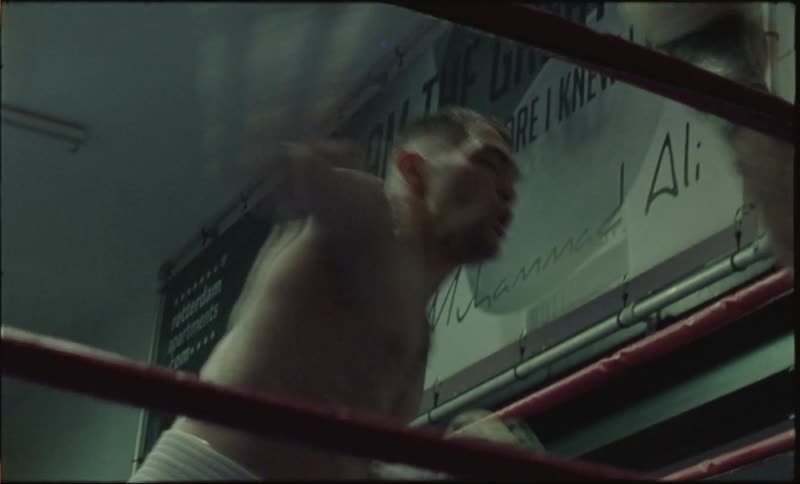 Two men boxing in a ring with precise and strong punches