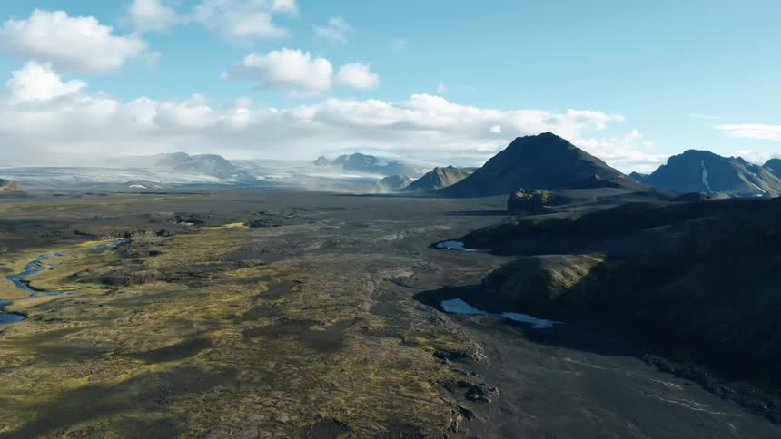 Aerial landscape of streams and mountains with mosses and desert soil