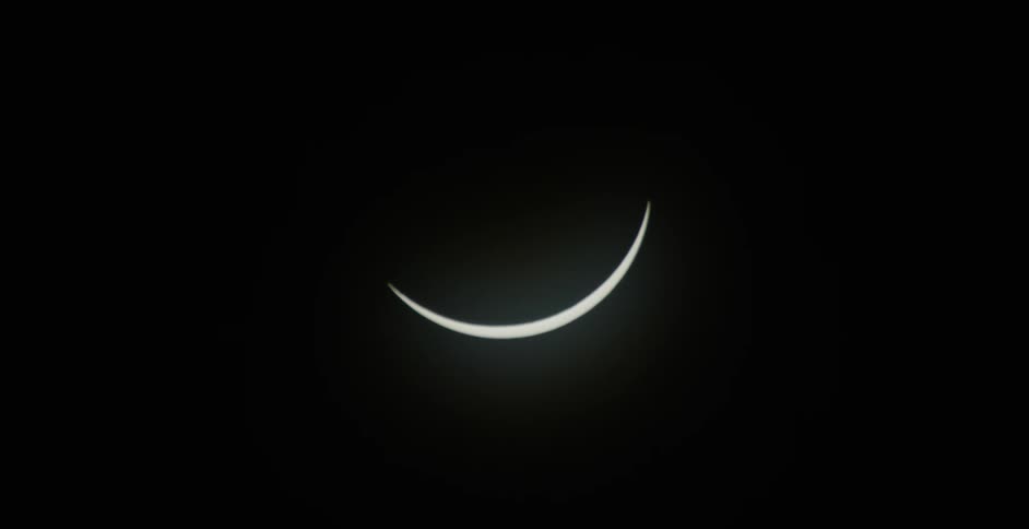 Waning moon against a dark sky