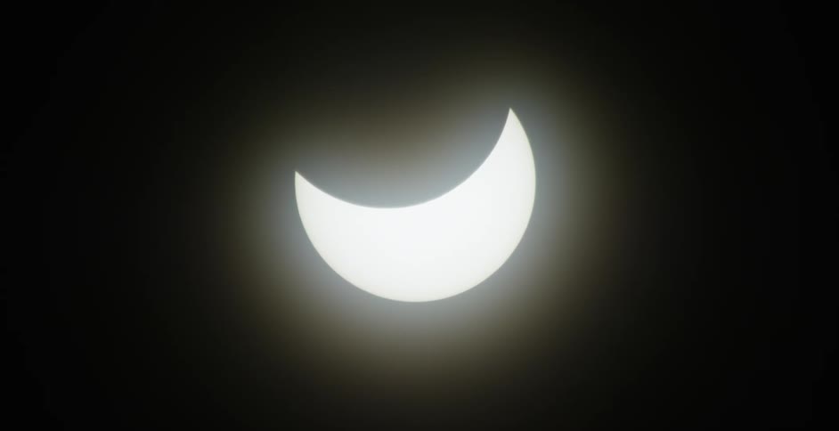 During a partial eclipse the moon only partially covers the sun leaving a crescent of sunlight visible