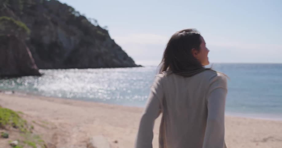 A footage of a lady close to the beach during summer