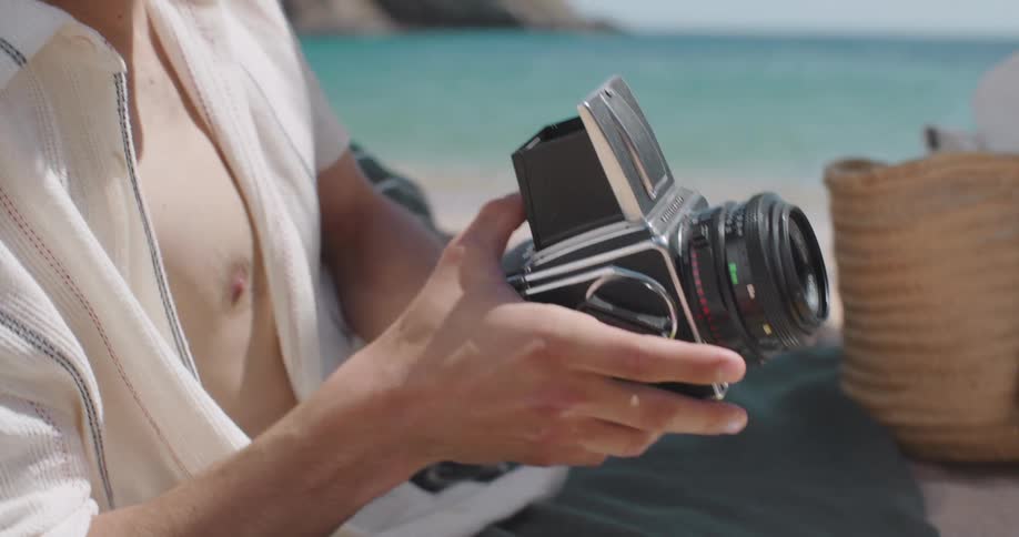 A clip of a male holding a camera