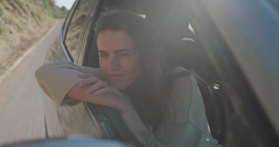 A clip of a female in a car