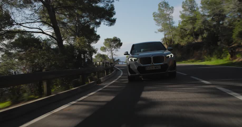 A car is driving on the road