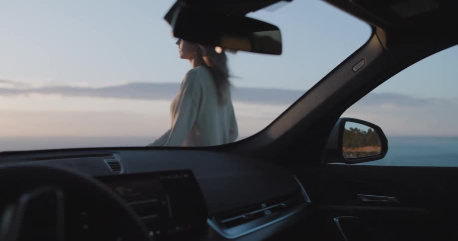 A clip of a lady coming down from a car