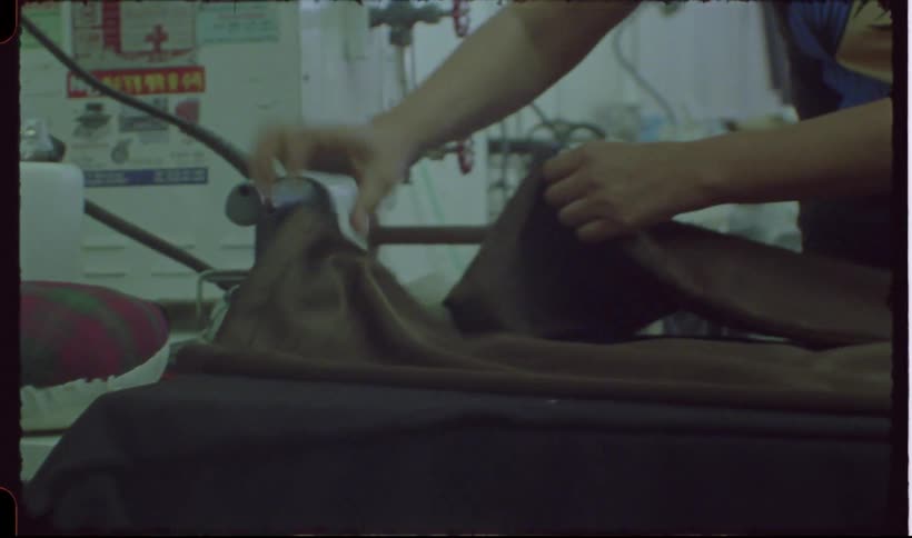 A woman is ironing clothing
