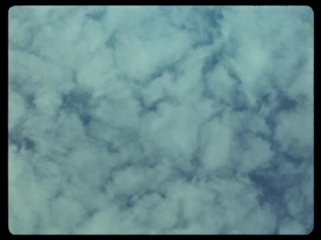 Upward view of a blue sky with clouds
