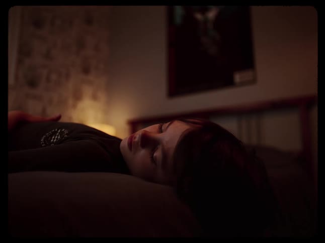 A person is resting in their bed