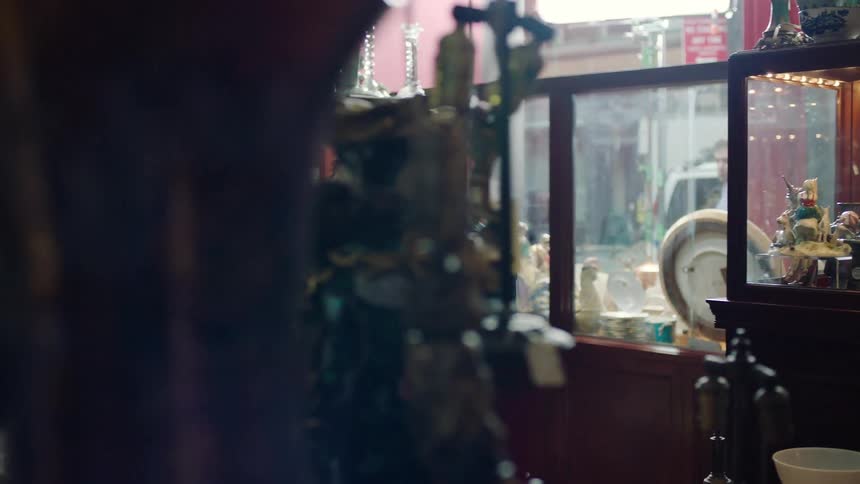Man walking and looking around in antique shop