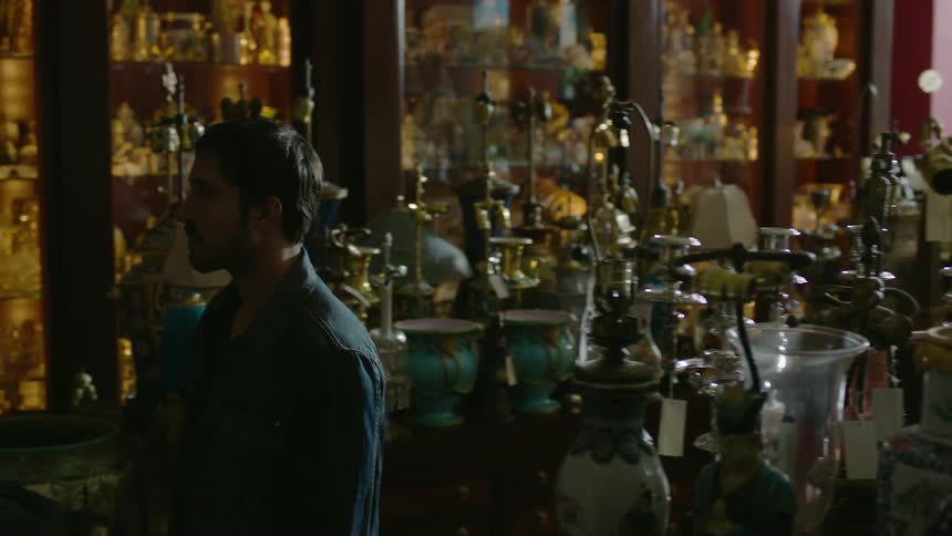 A man walks through an antique store