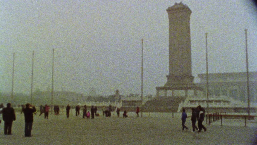 People are walking past the monument