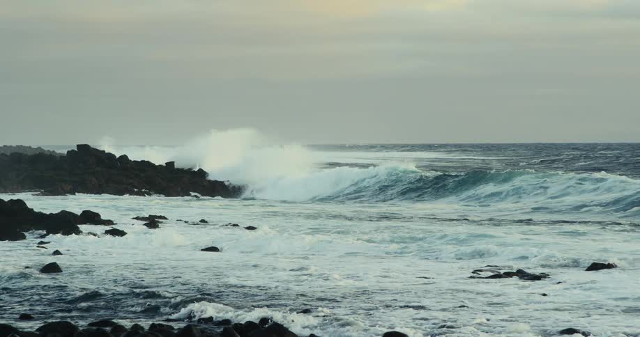 Strong waves hitting rocks on the sea coast
