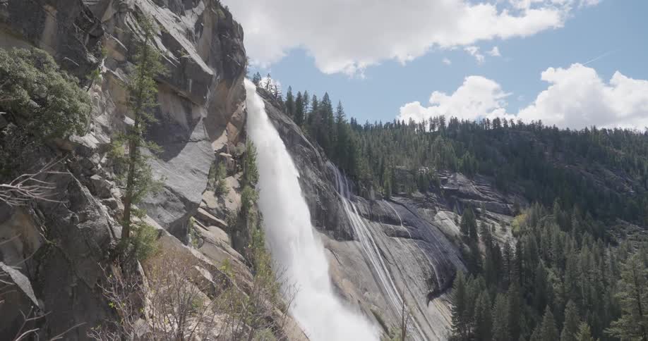 A waterfall falling down the side of a mountain