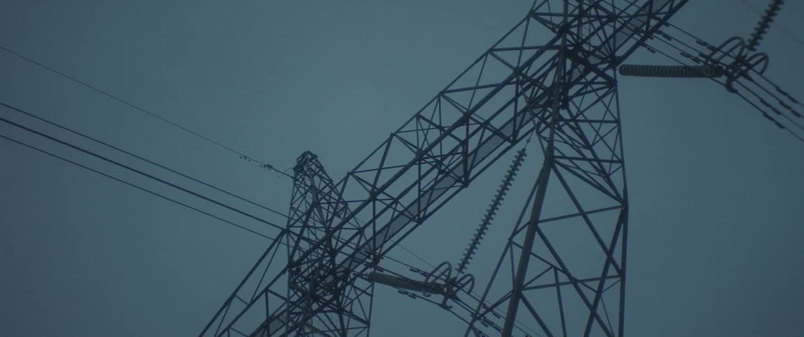 View upwards of electrical power transmission towers