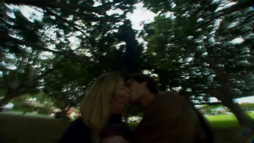 A clip of a man and a woman at a park having a good time