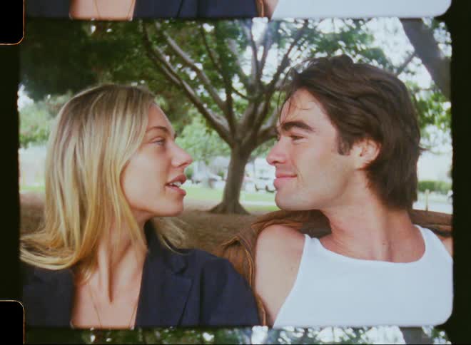A couple kiss in the park