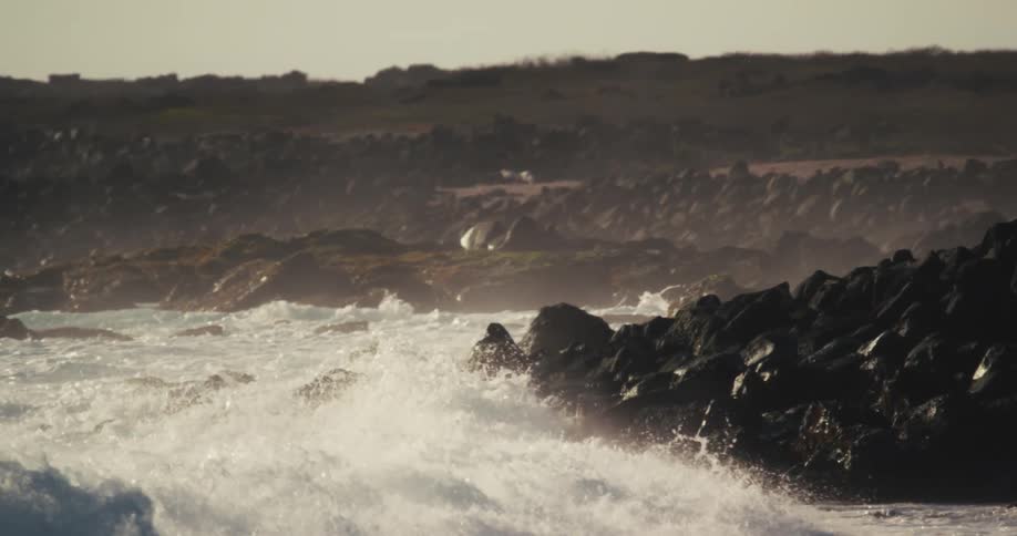 Landscape of waves crashing on coastal rocks