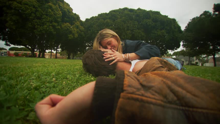 A clip of a man a woman kissing