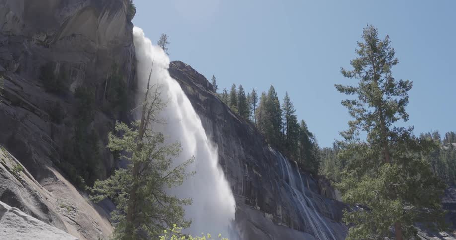 A waterfall flowing over a cliff at yosemite national park