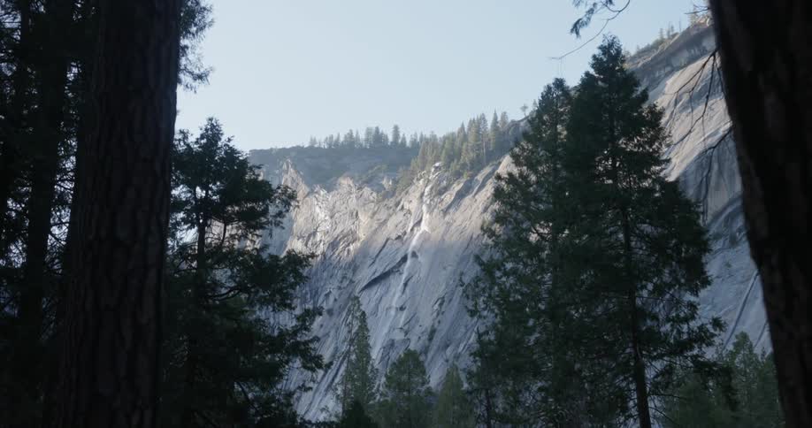 The mountains are past the forest