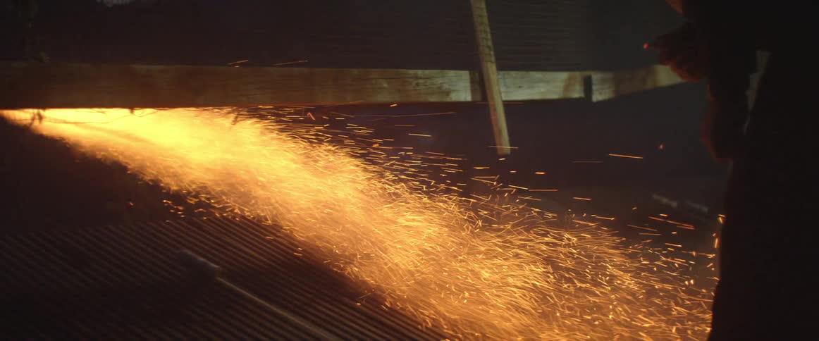 Person lighting off a firecracker in the dark