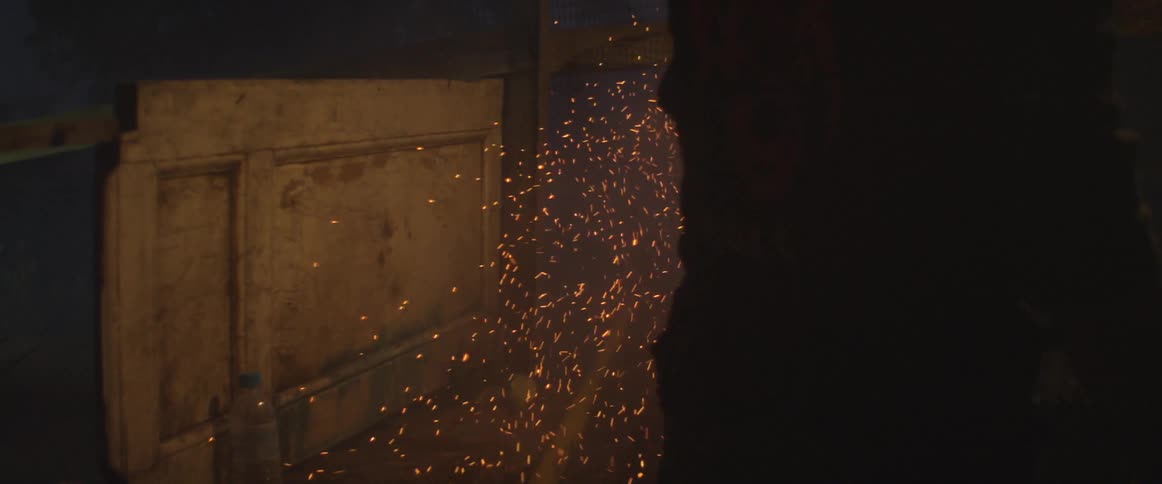 A firework shoots sparks and launches into the sky