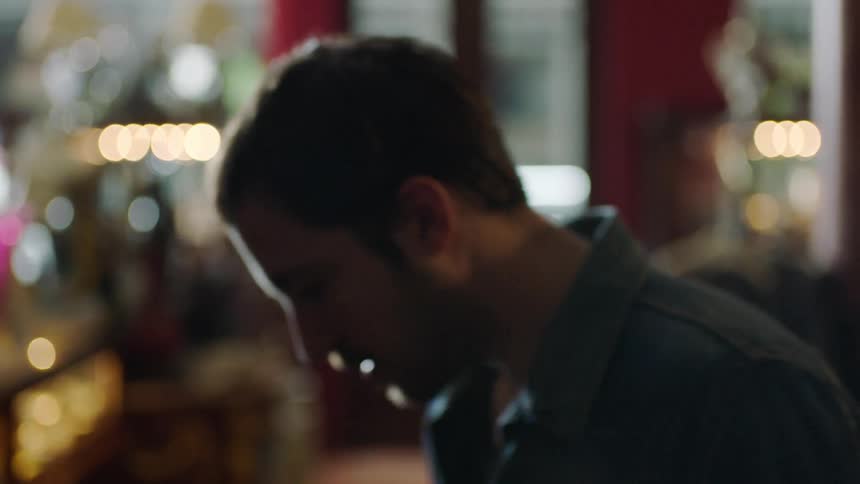 A man walks inside a shop in the city