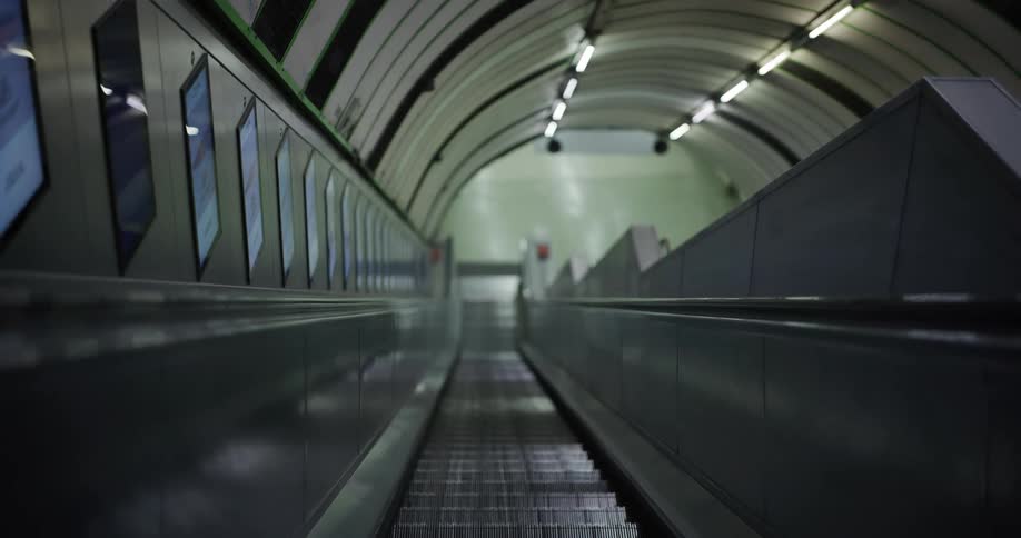 An empty escalator in an underground subway station