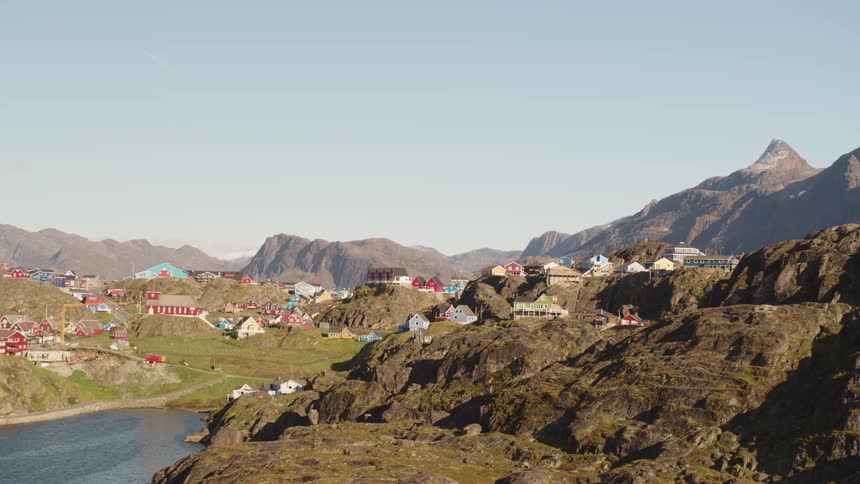 Colorful houses built in the middle of mountains by the sea